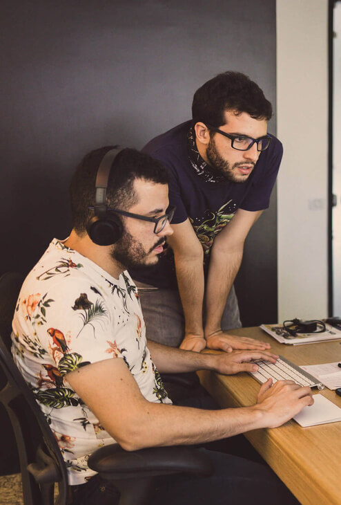 Two collaborators having fun while working together